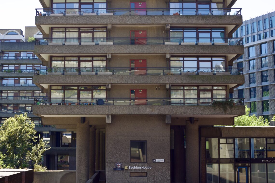 Front-on close up of the Seddon House at the Barbican Estate, focusing on the ground floor and the 4 floors above that.