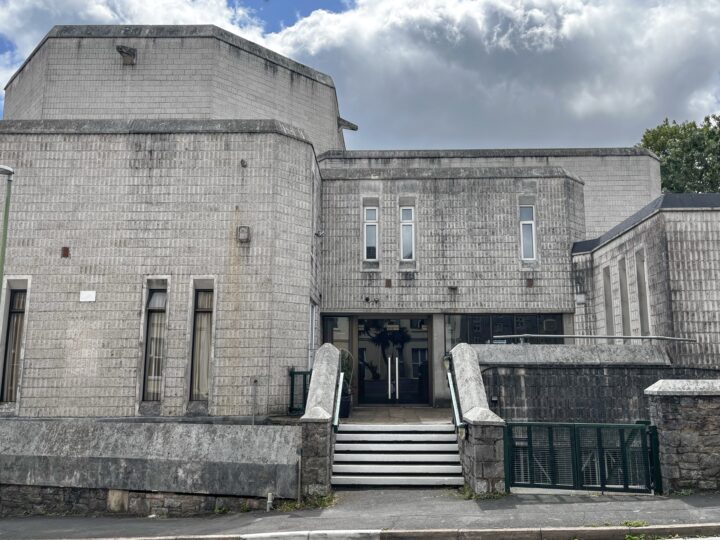 A building with steps leading to the entrance.