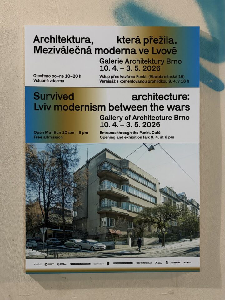 A bilingual exhibition poster features a photo of a modernist block of flats framed by trees and streetlights. The Czech and English text promotes an exhibition on Lviv modernism at the Gallery of Architecture Brno, running from 10 April to 3 May 2026.